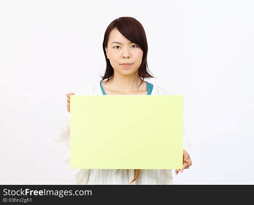 Portrait Of Young Woman Holding Blank Board