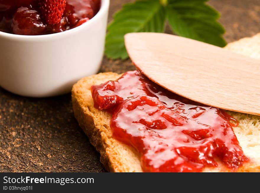 Wild strawberry jam with toast. sweet breakfast