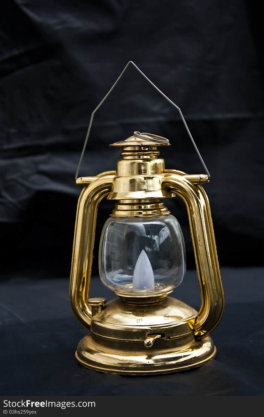 Old fashioned lantern in darkness. Light concept. Old fashioned lantern in darkness. Light concept.