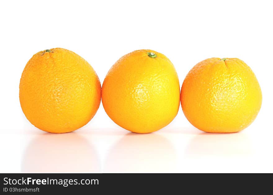 Tree oranges isolated on white