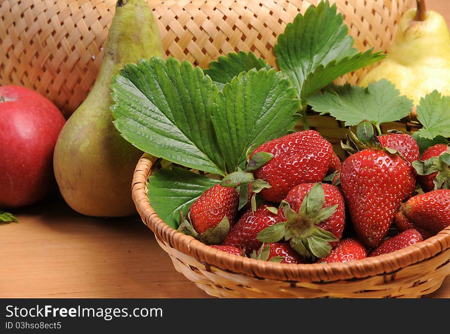 Ripe wild strawberry garden and green leaves. Ripe wild strawberry garden and green leaves.