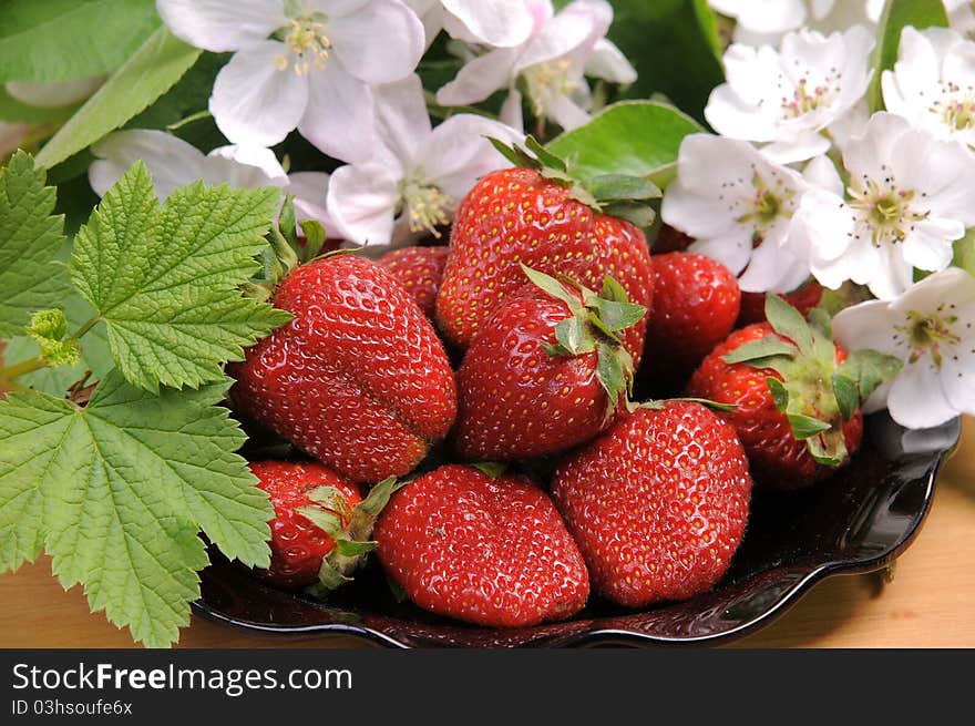 Ripe wild strawberry garden and green leaves. Ripe wild strawberry garden and green leaves.