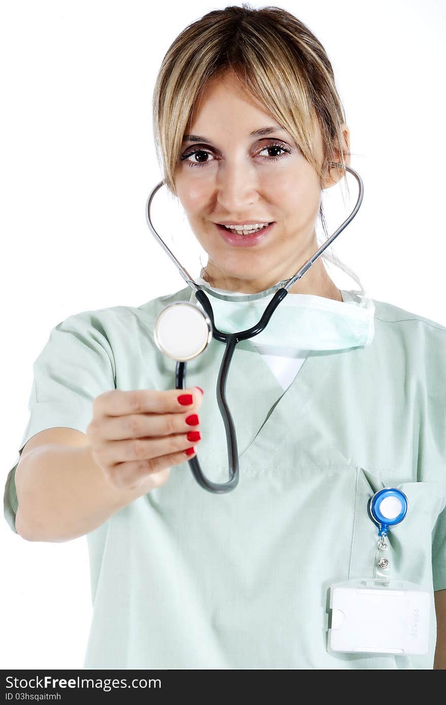 Smiling confident medical staff pointing with a stetoscope. Smiling confident medical staff pointing with a stetoscope