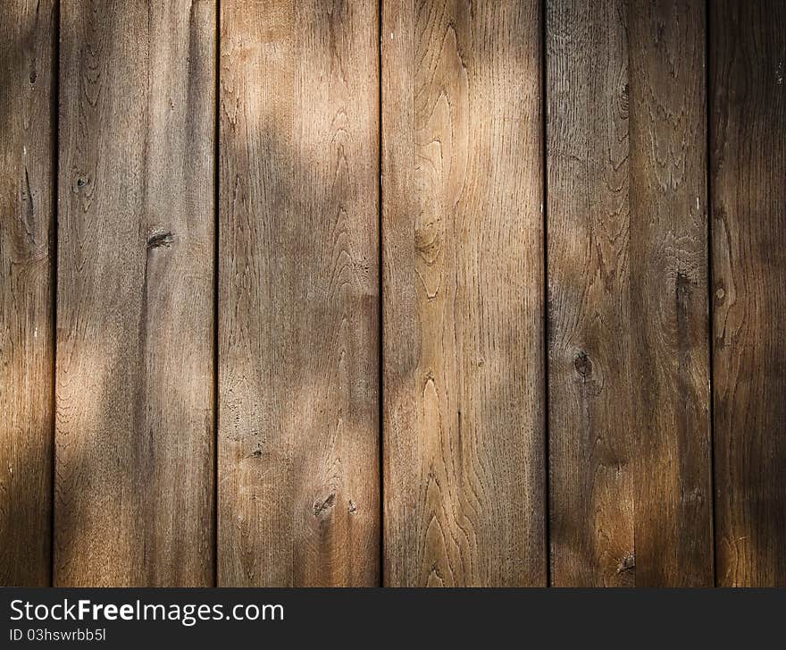 Play of lights on wooden wall background or texture. Play of lights on wooden wall background or texture