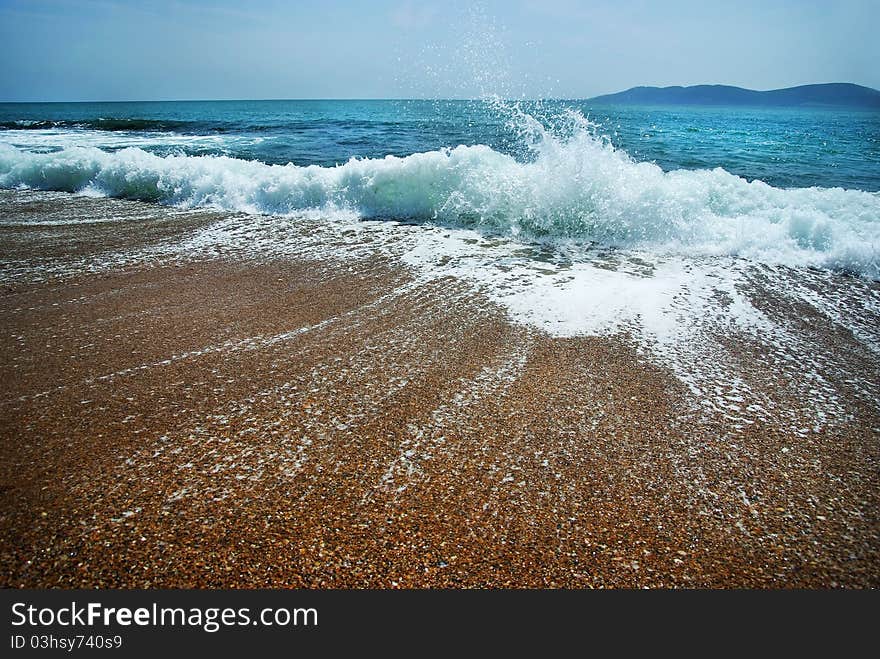 Blue wave on the sand sea beach