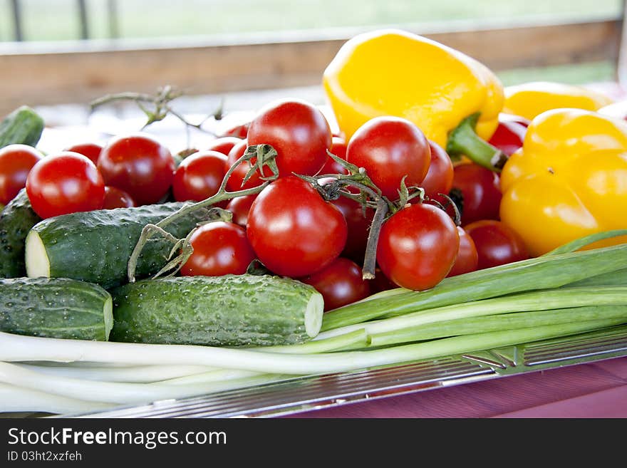 Full frame photograph of a broad variety of fruits and vegetables; colorful and plentiful. Full frame photograph of a broad variety of fruits and vegetables; colorful and plentiful