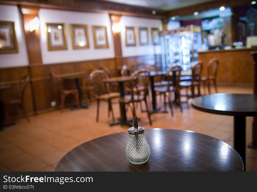 Ordinary sugar stands alone on a table