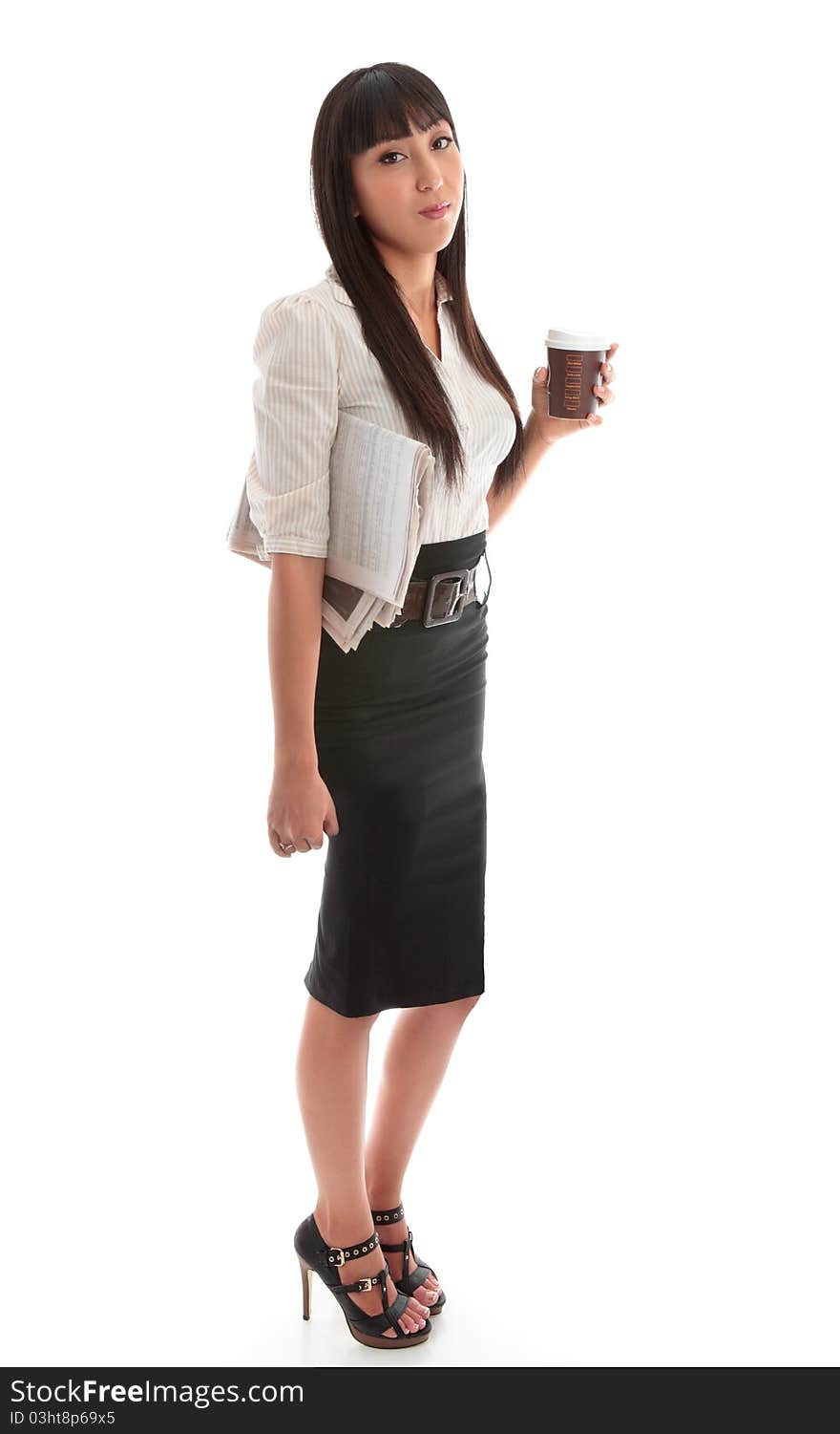 A young successful businesswoman wearing black skirt and striped blouse. A young successful businesswoman wearing black skirt and striped blouse.