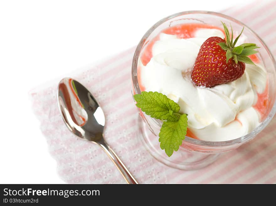 Dessert with cream and strawberries in portion bowl