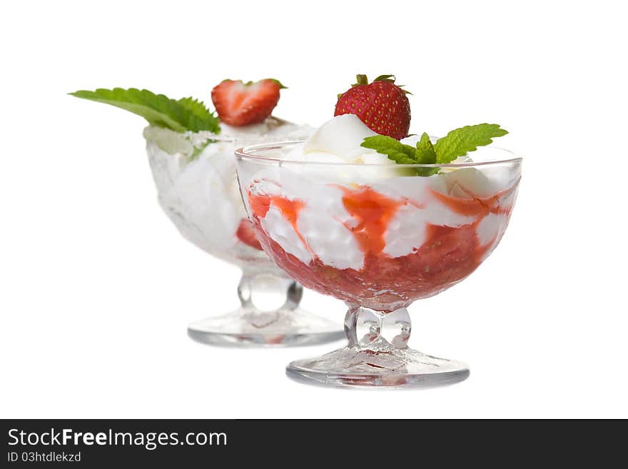 Dessert with cream and strawberries. Isolated over white