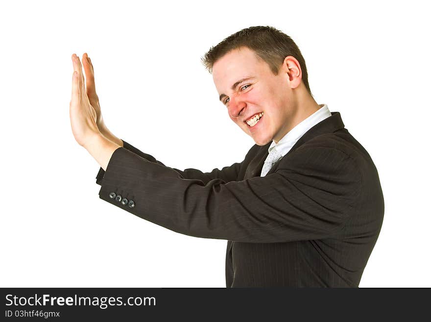 Young businessman pushing up on an isolated background