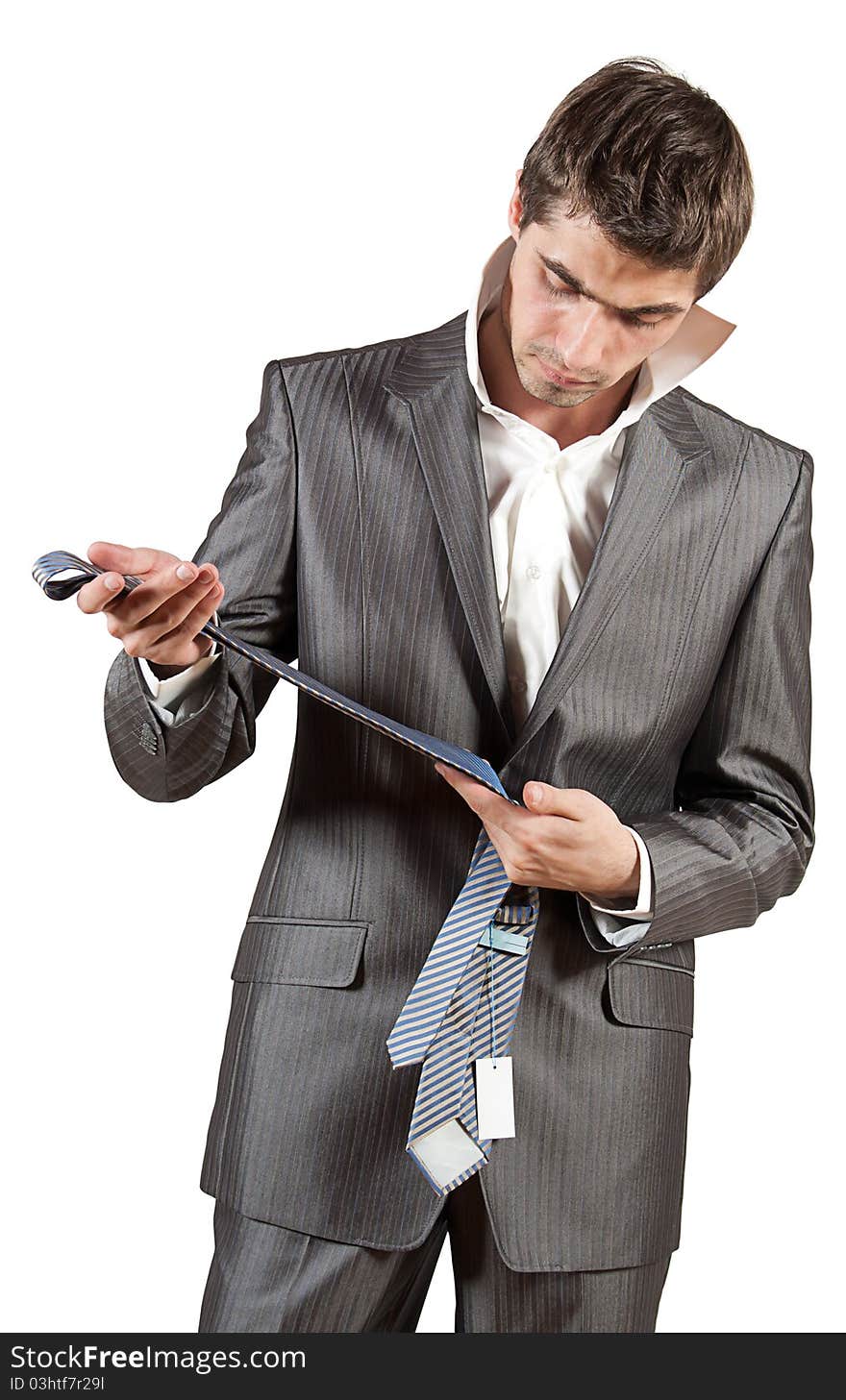 Portrait of a young dressing elegant man in classical suit on isolated white background