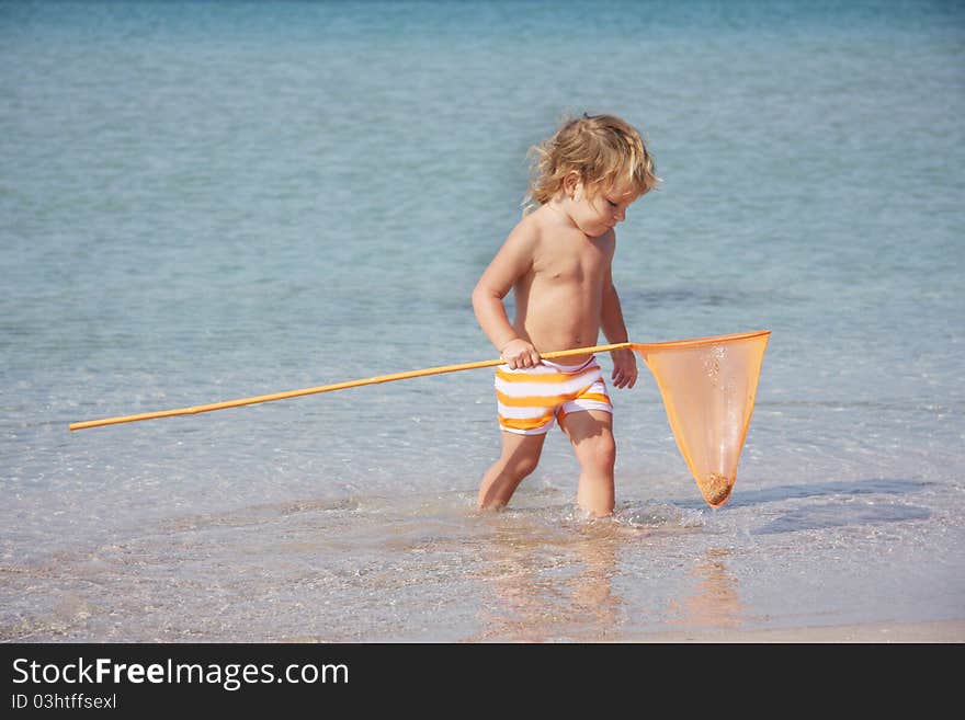 Cute child playing in water