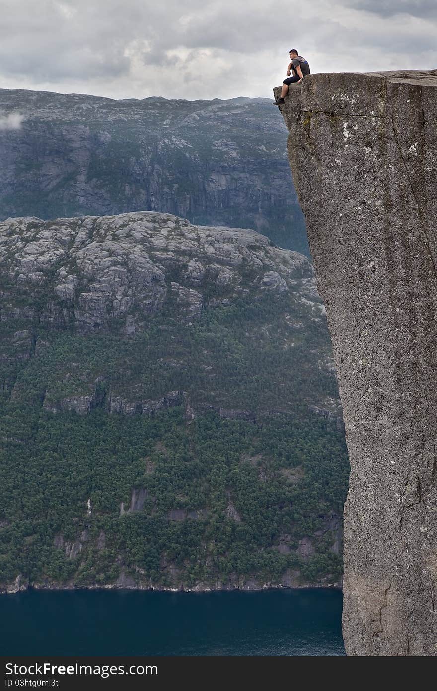 Man sitting on the rock. Norway. Man sitting on the rock. Norway.