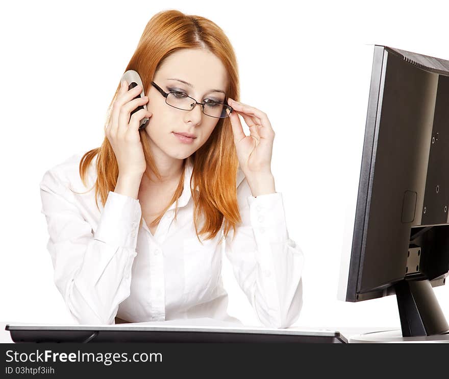 Smiling young business woman calling by phone. Studio shot.