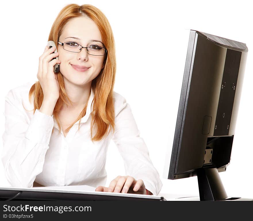 Smiling young business woman calling by phone. Studio shot.