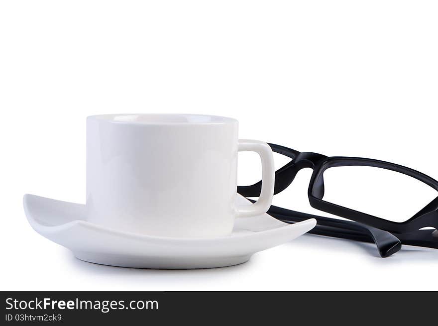 Eyeglasses and coffee cup. Objects isolated on white background shadow below.