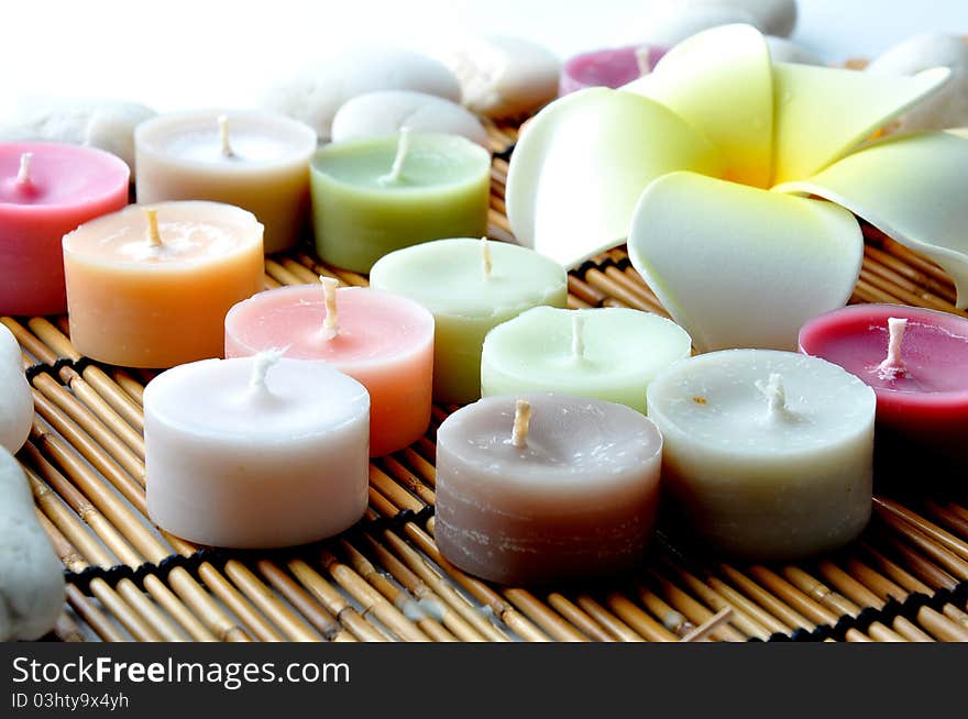 Candles And Stones On Bamboo Mat