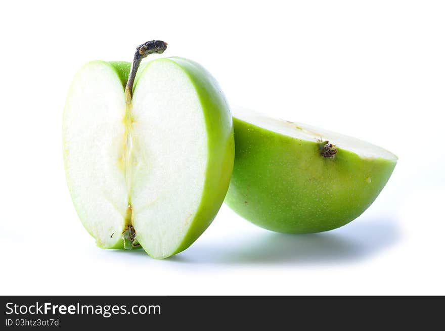 Two pieces green apple isolated on white background.