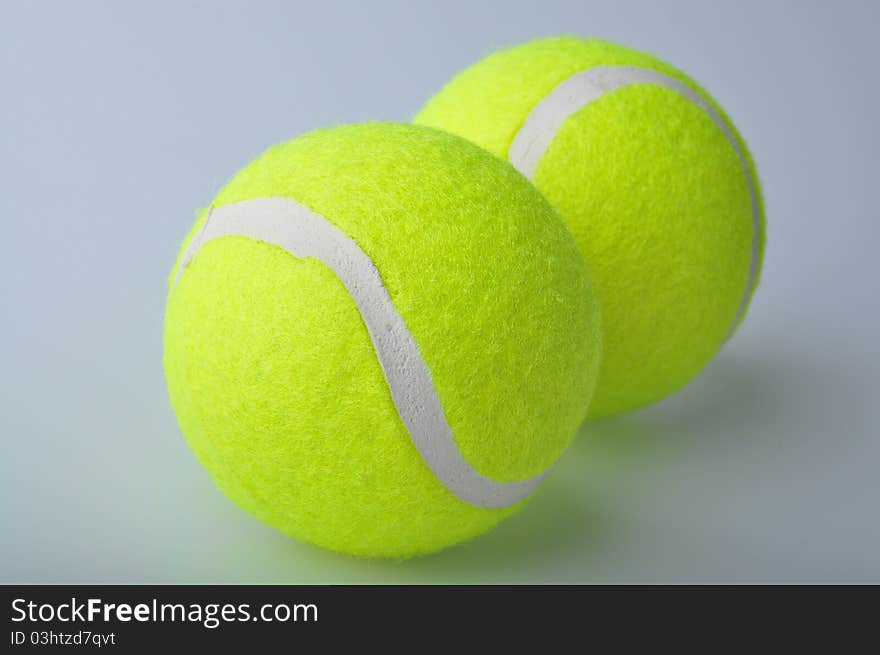 Two tennis balls isolated on the white background.