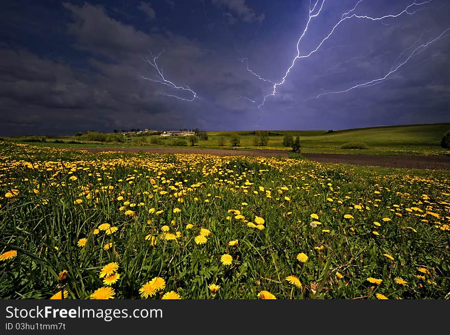 Landscape with a storm sky and lightnings