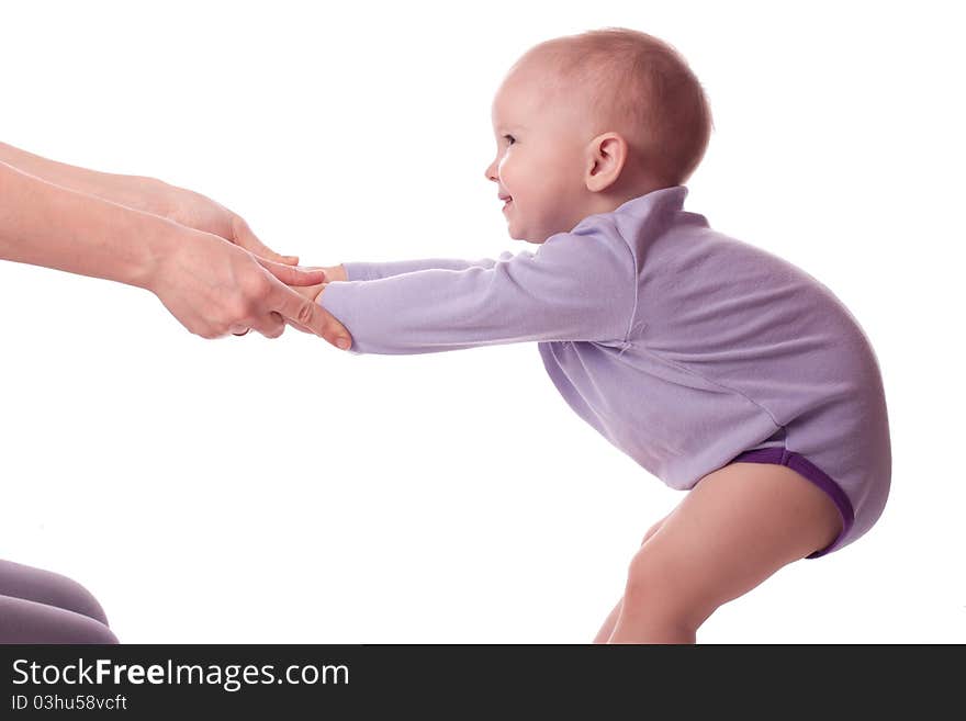 Smiling little girl holding mother hands and making gym