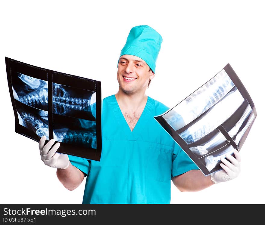 Portrait of a surgeon looking at the x-ray photographs. isolated on white background