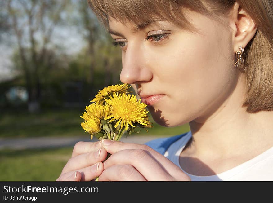 Girl and dandelions