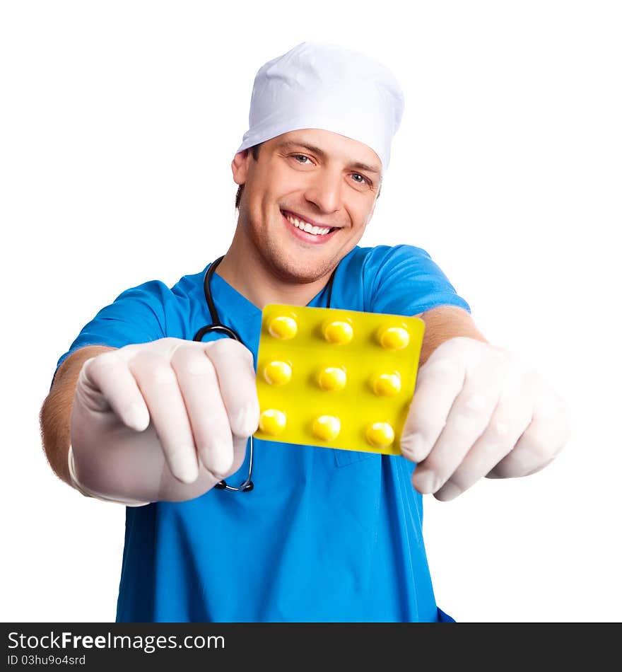 Portrait of doctor wearing a blue uniform and giving us pills. isolated on white background. Portrait of doctor wearing a blue uniform and giving us pills. isolated on white background