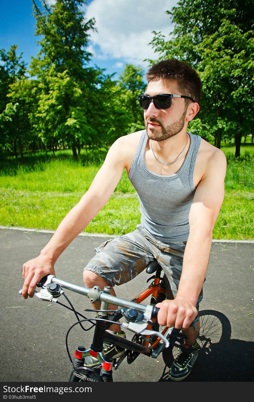 Young man cyclist sitting on bicycle