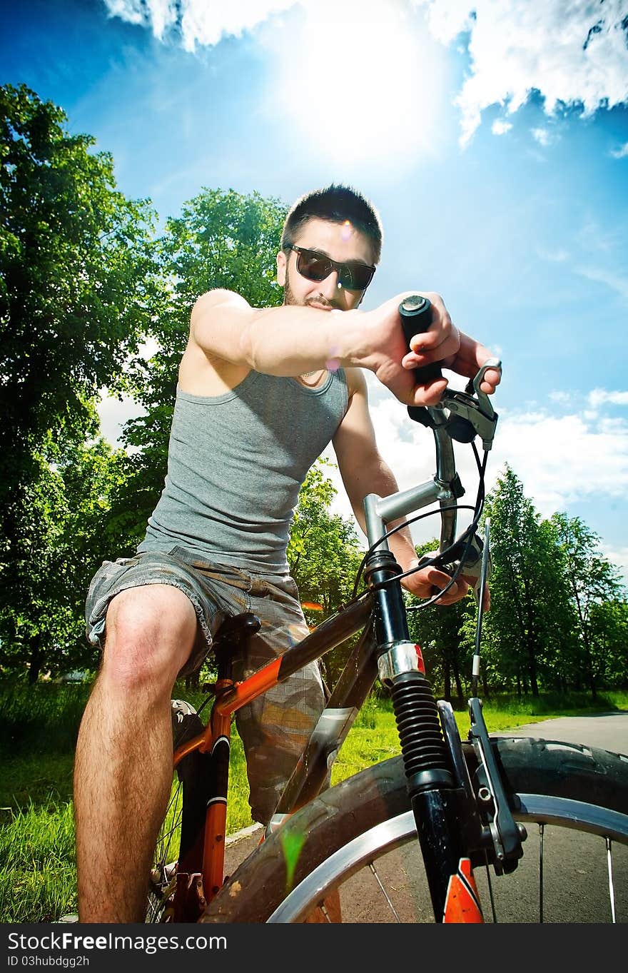 Young man cyclist sitting on bicycle