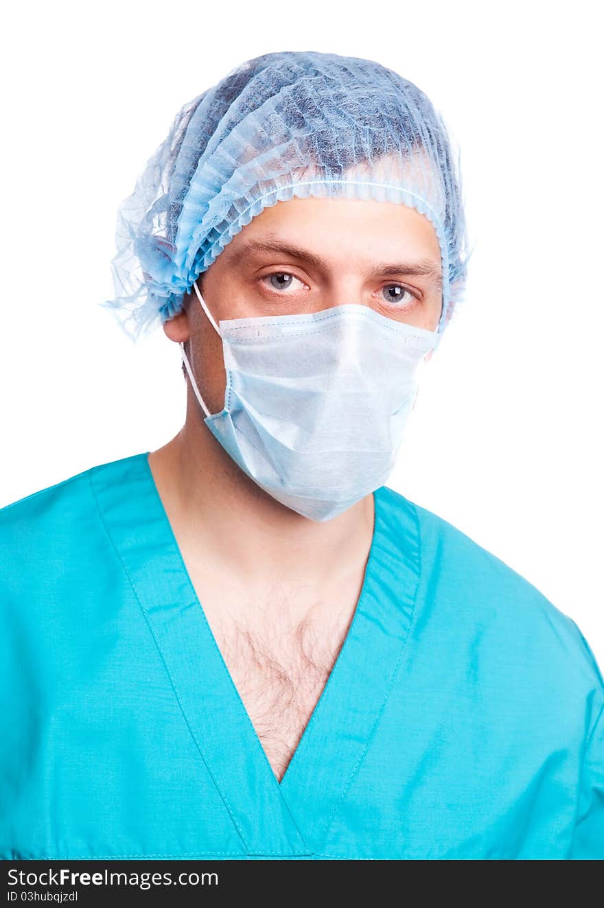 Portrait of a surgeon wearing a mask and green uniform. isolated on white background