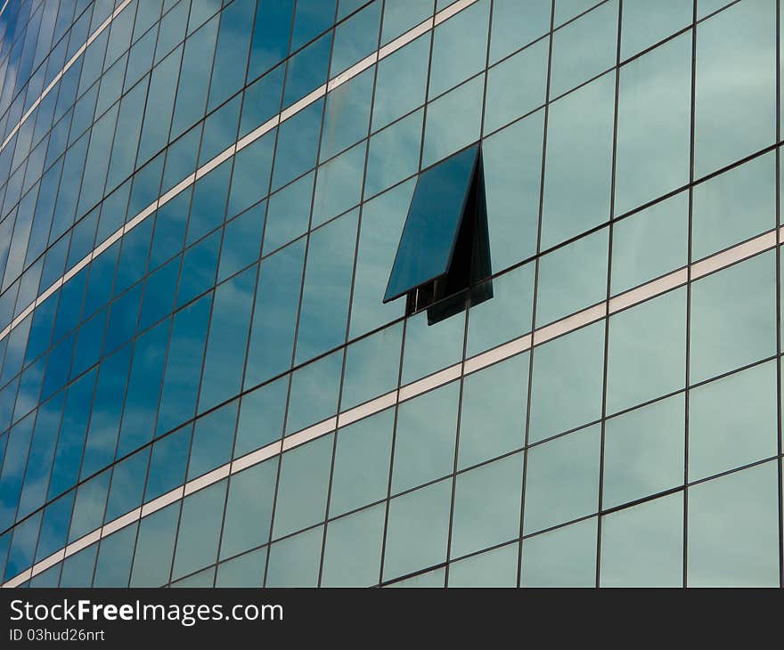 Modern blue glass wall of skyscraper