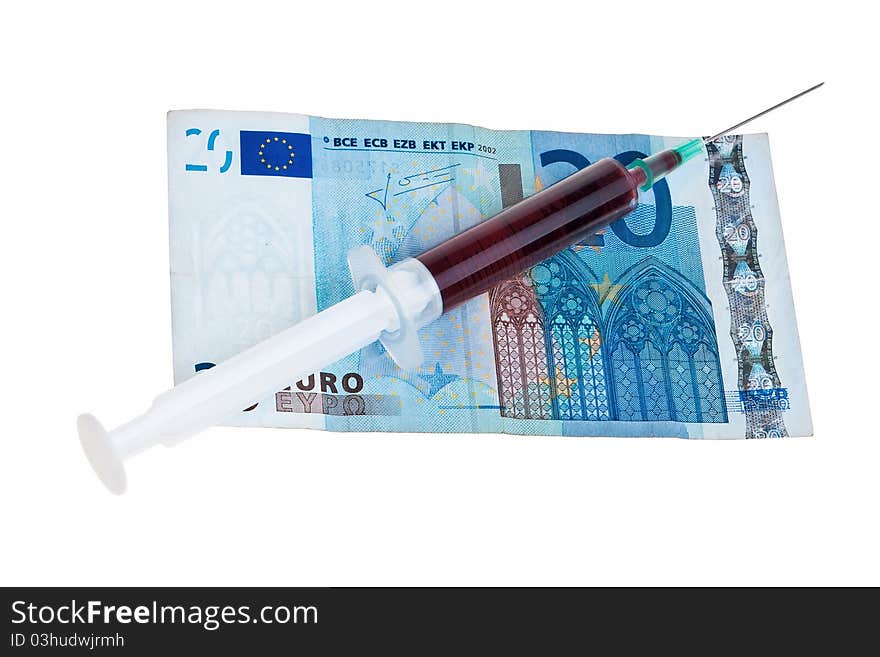 Syringe with red liquid.