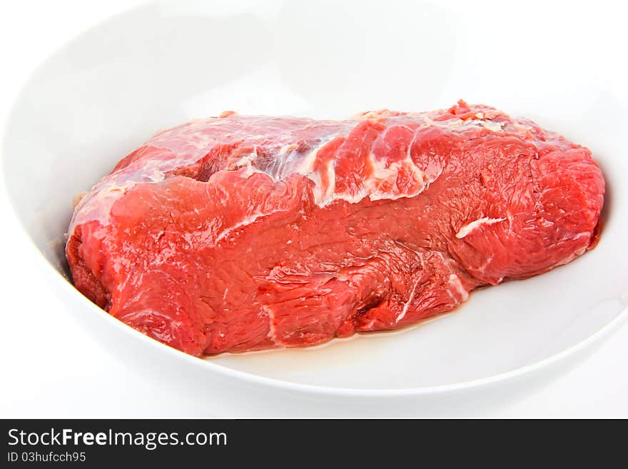 Fresh deer meat. close up, on white background