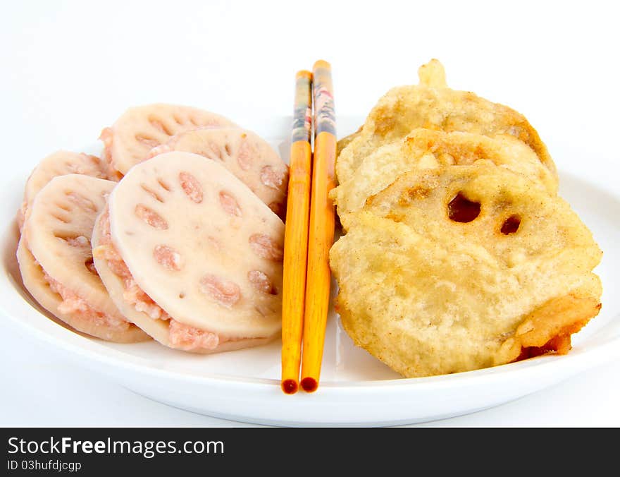 Lotus root. Close up. Chopsticks in the middle of the picture