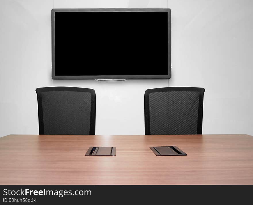 Business meeting room with wooden table and seats. Business meeting room with wooden table and seats.