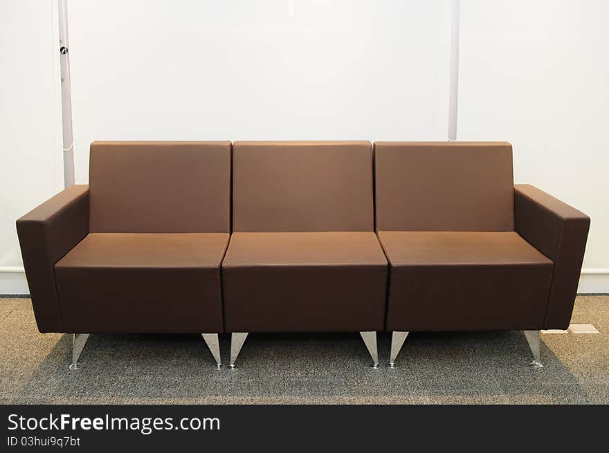 Brown leather couch on a carpet. Brown leather couch on a carpet.