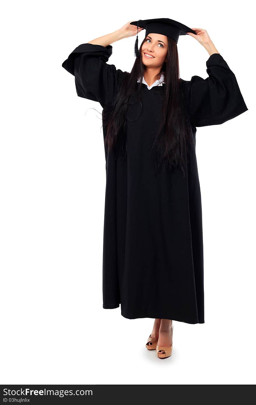 Educational theme: graduating student girl in an academic gown. Isolated over white background.