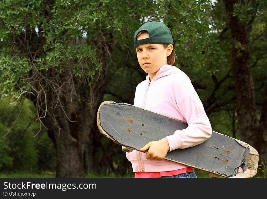 Cut young girl with well used scateboard