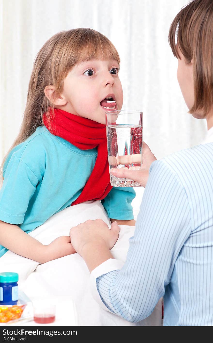 Sick little girl sitting on bed with her mother or doctor. Sick little girl sitting on bed with her mother or doctor