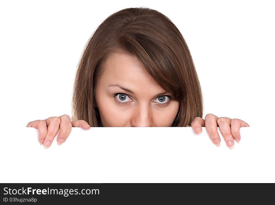 Portrait of a beautiful young woman with blank billboard on white background