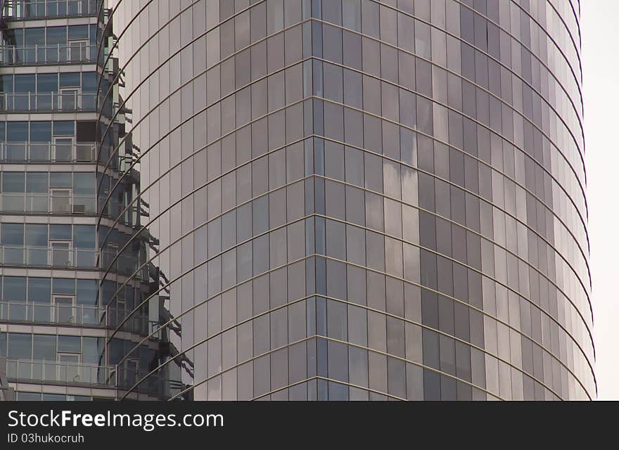 Part of madern building from grey glass. Part of madern building from grey glass