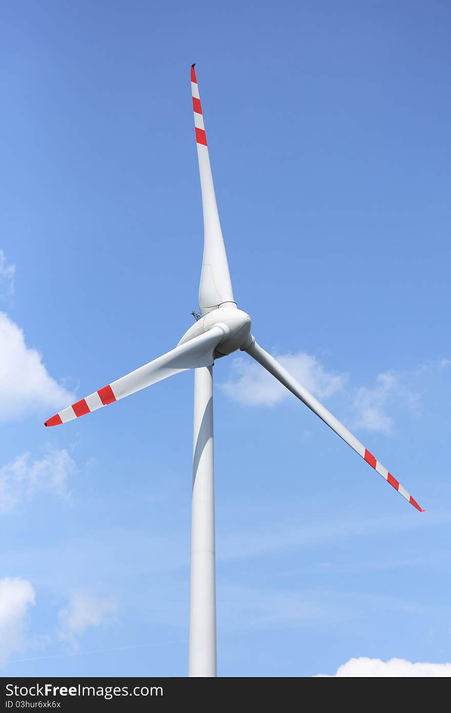 Wind turbine on sunny day in summer