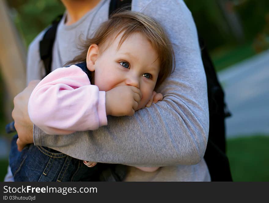 Father holding his baby girl on his arms. Father holding his baby girl on his arms