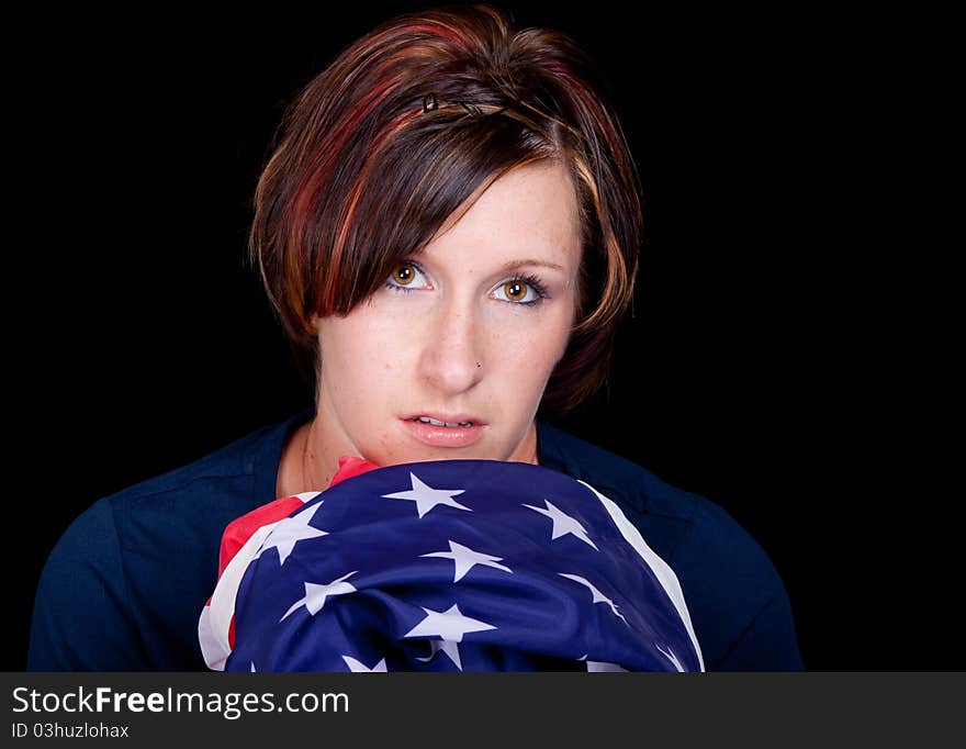 A nice image of a woman holding an American Flag.