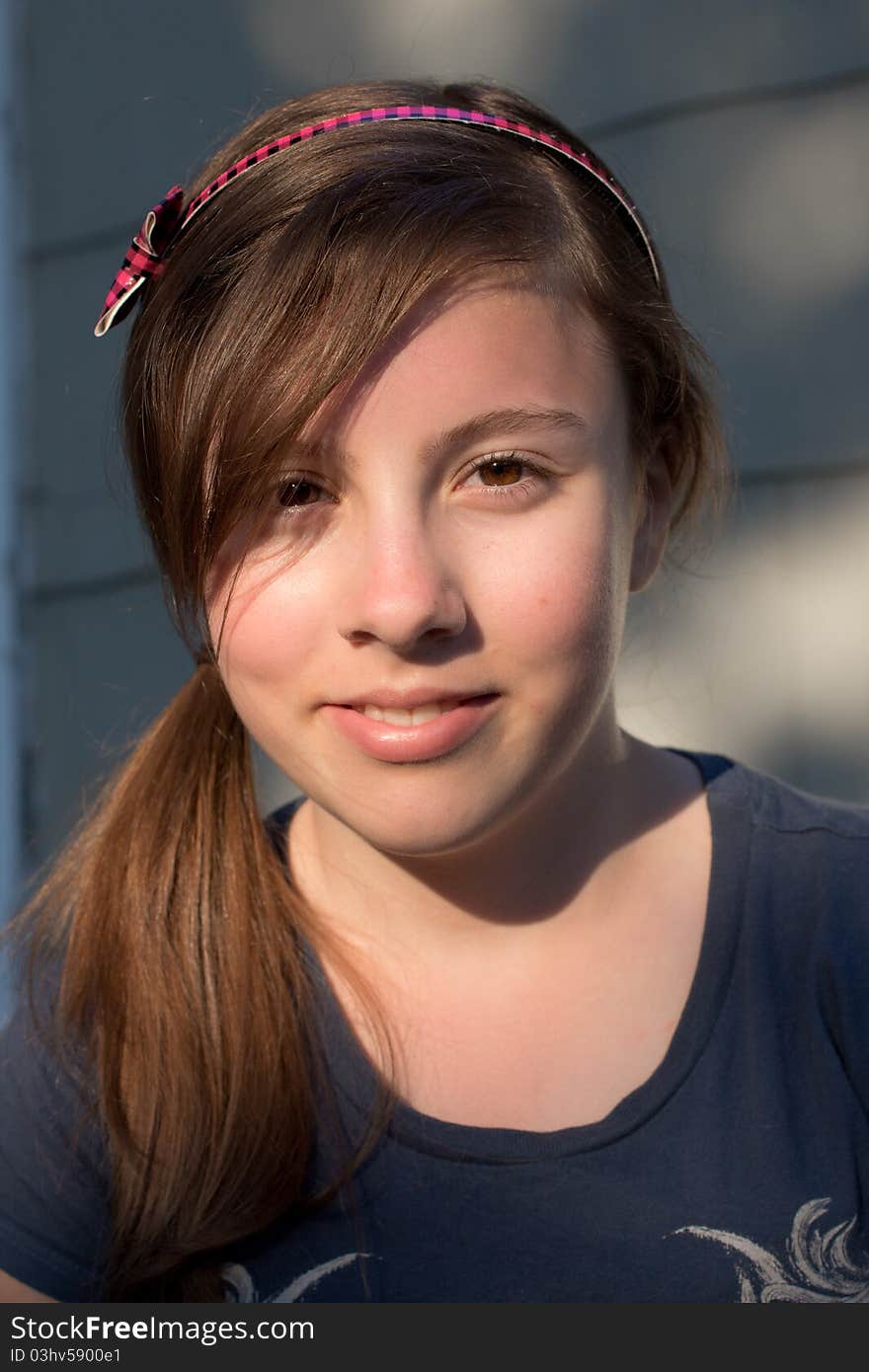 A nice portrait of a cute teenage girl in the evening sun. A nice portrait of a cute teenage girl in the evening sun