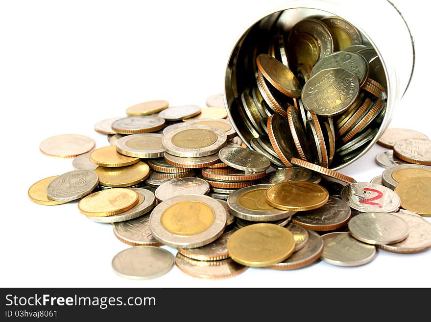 Coins in a aluminum can over a white background. Coins in a aluminum can over a white background