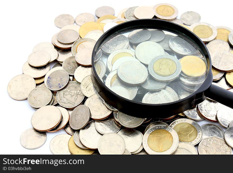 Magnifying Glass And Lots Of Gold Coins