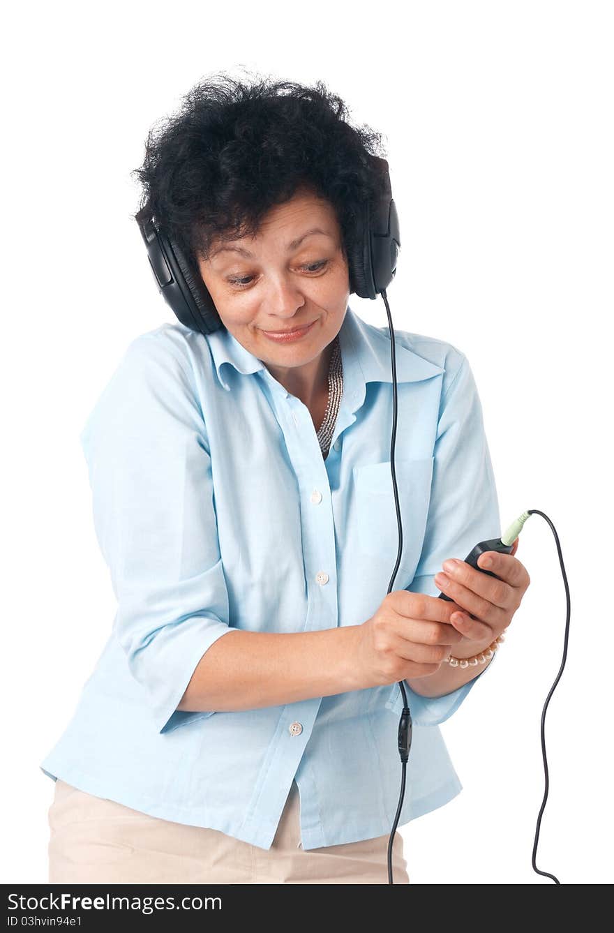 Elder happy woman with phones and mobile listening something. Elder happy woman with phones and mobile listening something.